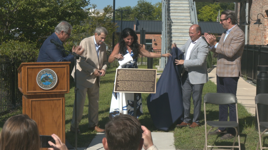 Left to right: Mayor Bill Saffo, Steve Stein, Jennifer Stein, Andy Mitwol, and Councilman Luke Waddell unveil a historical maker on August 27, 2025. (Photo: Nate Mauldin/WWAY)