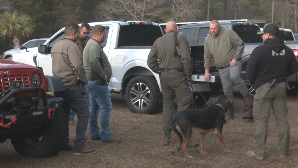 Officers standing at the front of Belinda Edwards home.