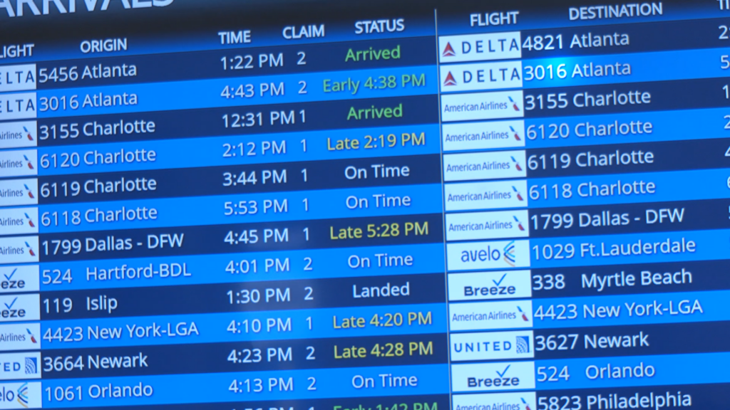 Display screen showing flight at ILM Airport