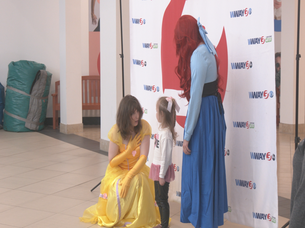 Kids meeting princesses at WWAY's Family and Kid's Expo