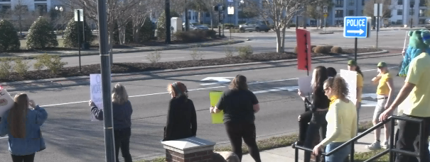 Protestors gather at 1898 Memorial Park
