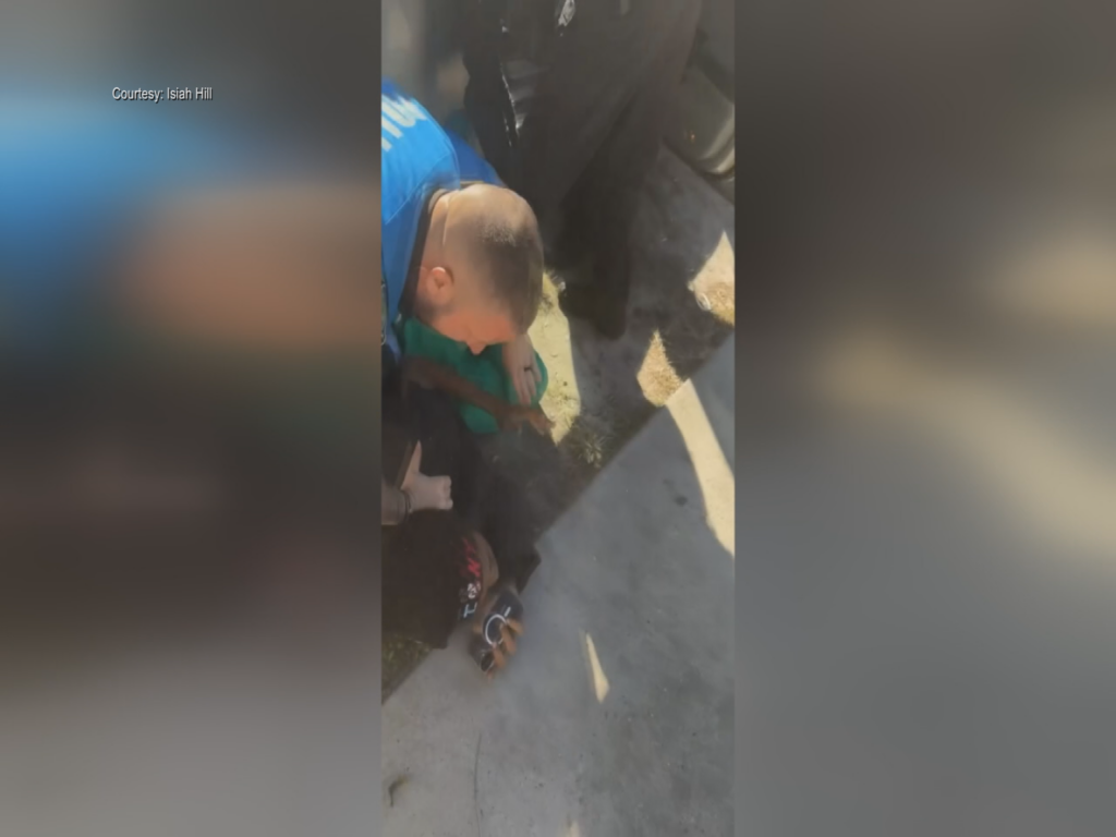 Wilmington Police officer arresting a man