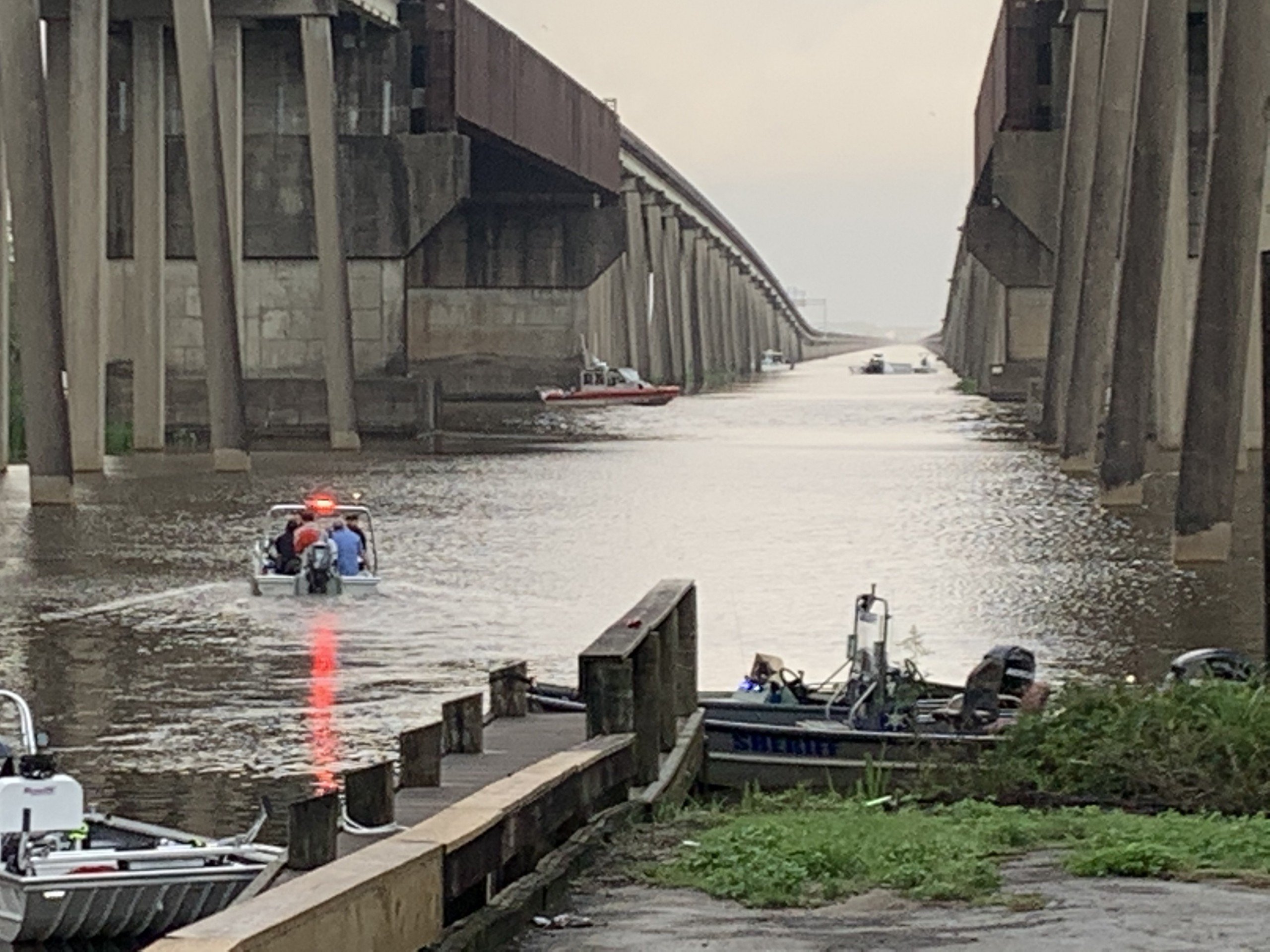 1 dead, 1 rescued after crash sends 18wheeler off bridge into