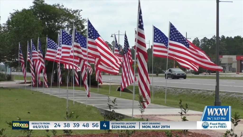 Community Gathers For Avenue Of Flags Ceremony In Gautier