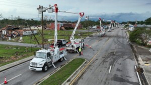 Bucket Trucks Down Main St Moss Point