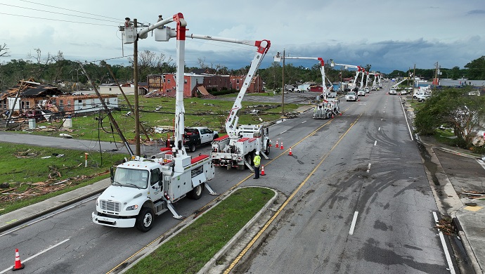 Bucket Trucks Down Main St Moss Point