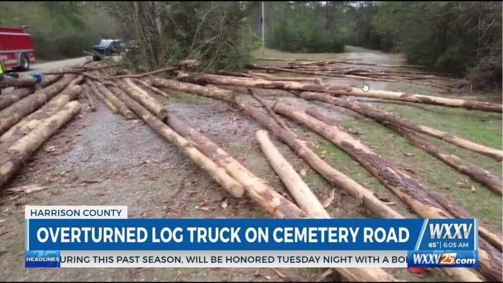 Log Truck Overturns On Cemetery Road