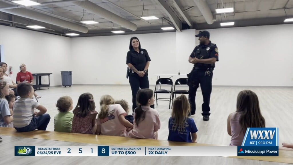 Biloxi Police Officers Read To Children At Summer Reading Program