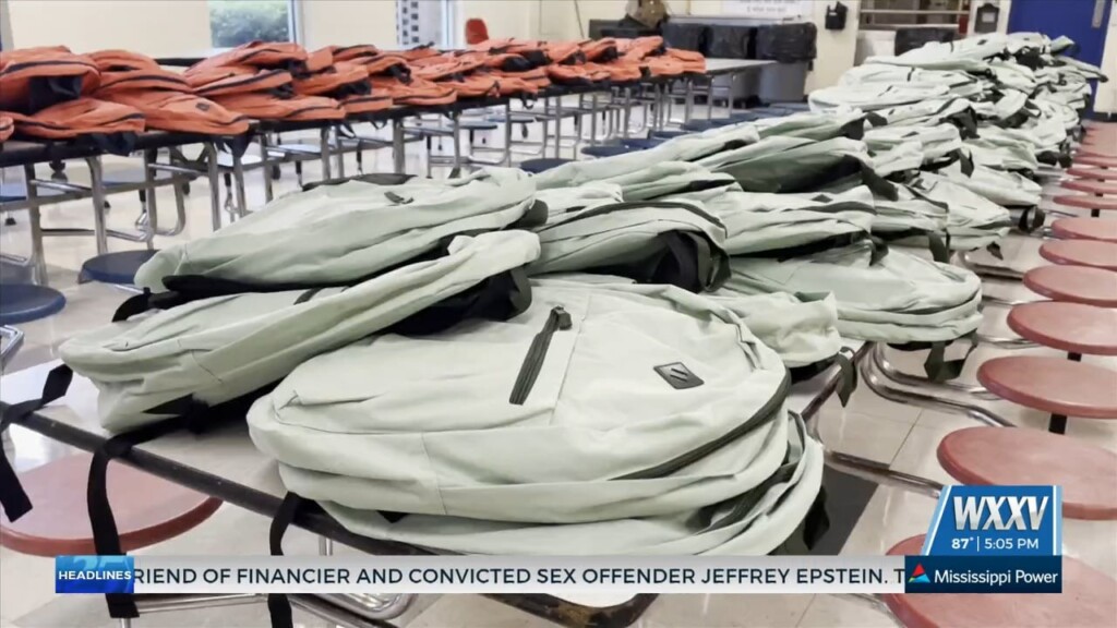 J. Allen Holds Backpack Giveaway