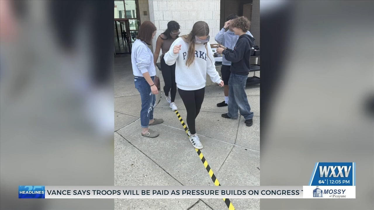 Law enforcement demonstrates dangers and effects of impaired driving with goggles