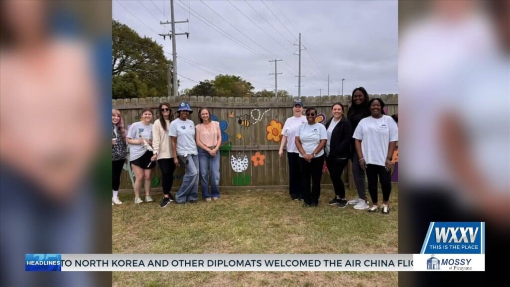 Junior Auxiliary Of Gulfport Helps Paint Fence At Harrison County Youth Court