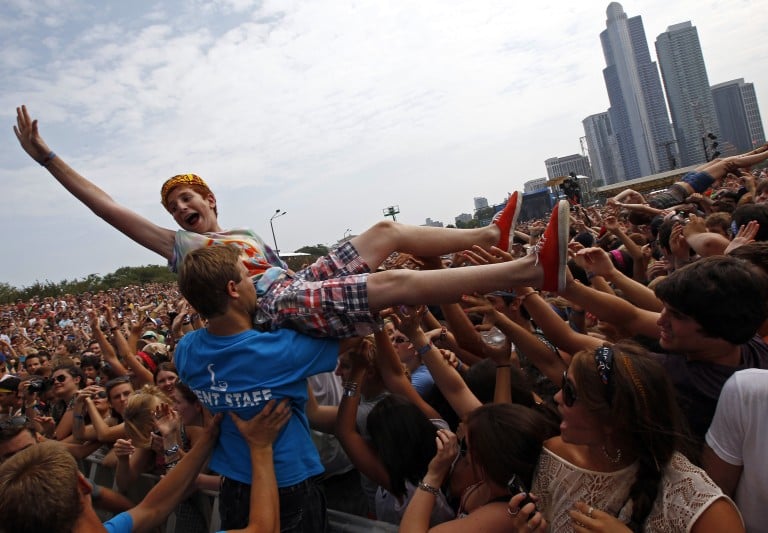A Music Fan Crowd Surfs During A Performance By "foster The People" At The Lollapalooza Music Festival In Grant Park In Chicago