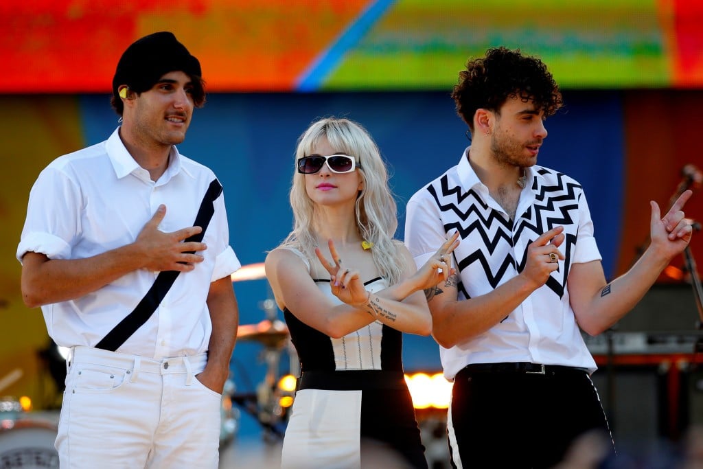Paramore Band Members Haley Williams Zac Farro And Taylor York Pose On Stage