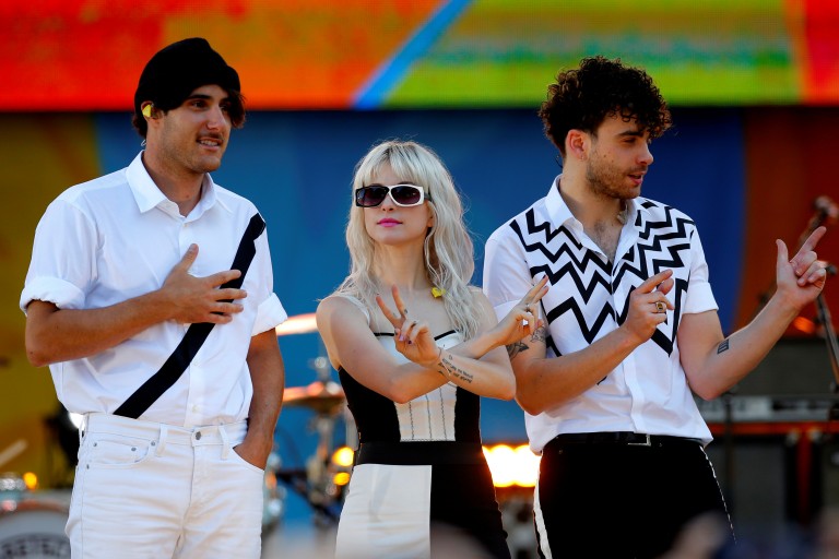 Paramore Band Members Haley Williams Zac Farro And Taylor York Pose On Stage